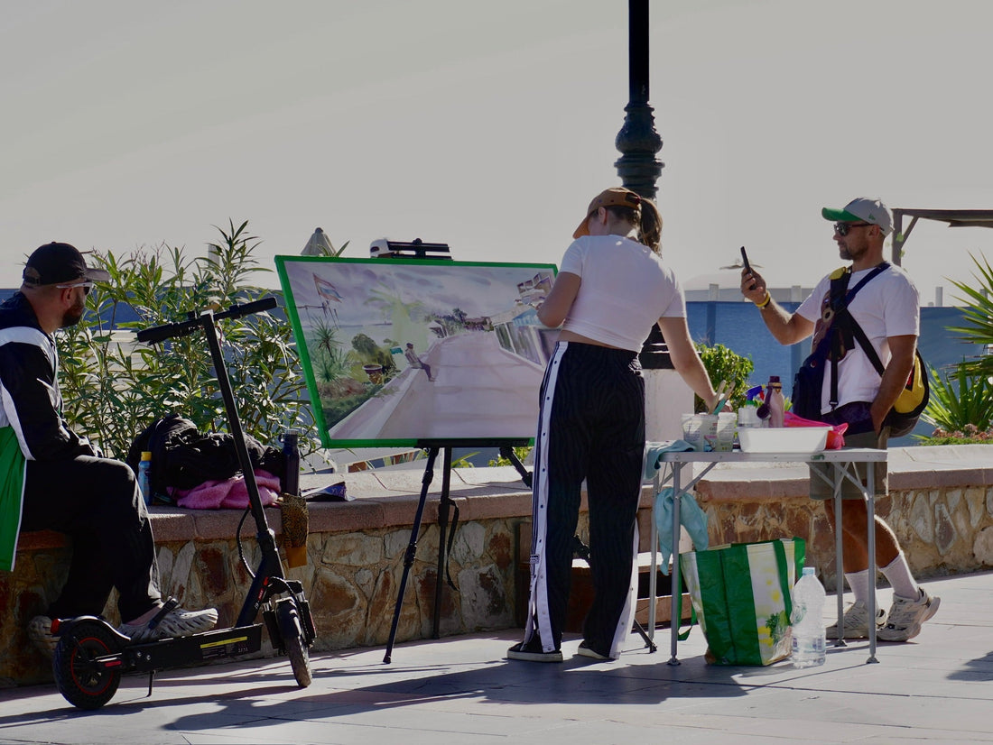 Artist Maryna Riepnova talking with tourists and art lovers in Torremolinos