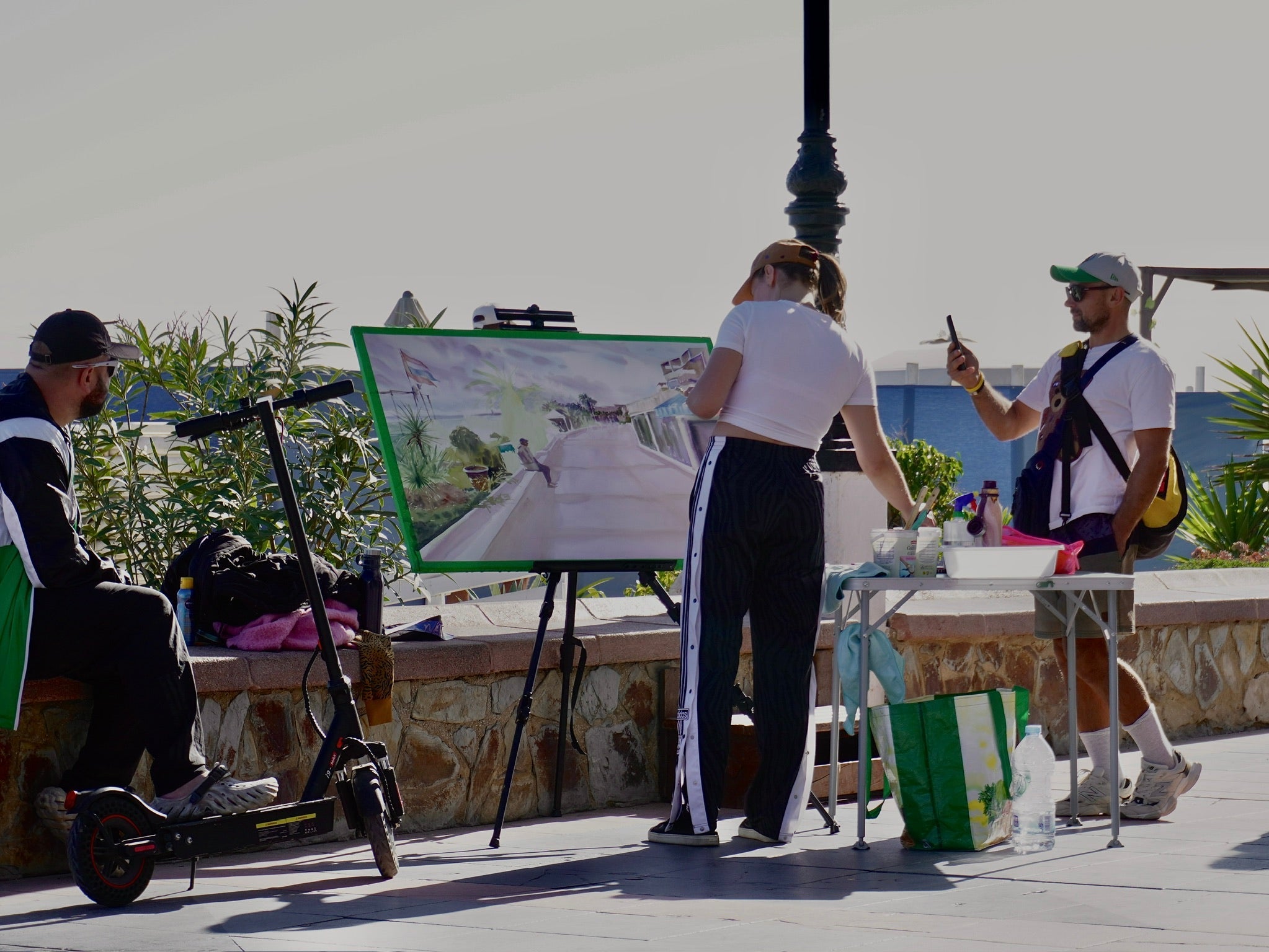 Artist Maryna Riepnova talking with tourists and art lovers in Torremolinos